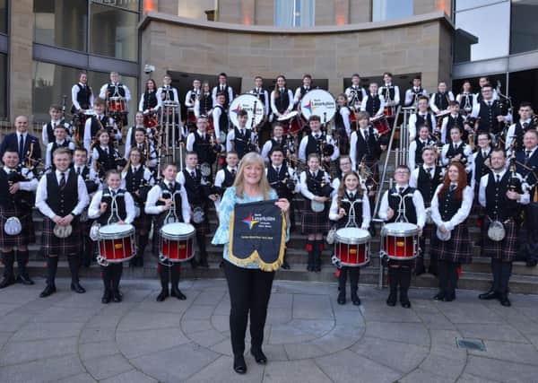 UK Steel Enterprise regional manager Anne Clyde with North Lanarkshire Schools' Pipe Bands at Glasgow Royal Concert Hall