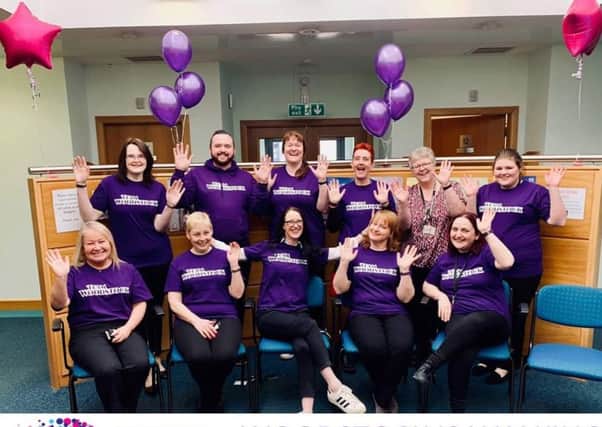 Best foot forward...a 30-strong team at Woodstock Medical Centre in Lanark have notched up millions of miles this month for Cancer Research UK.