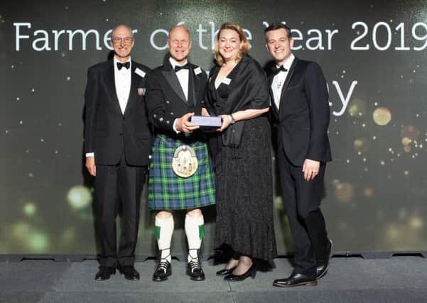 Cream of Galloway's David Finlay (in kilt) accepts Farner of the Year Award. Ap. 2019