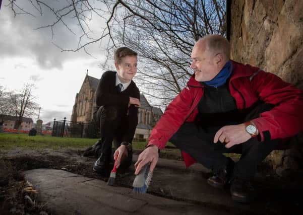 Mark McGettigan, who found the stones is pictured with Professor Stephen Driscoll, Professor of Historical Archaeology at the University of Glasgow. (Photo: Martin Shields)