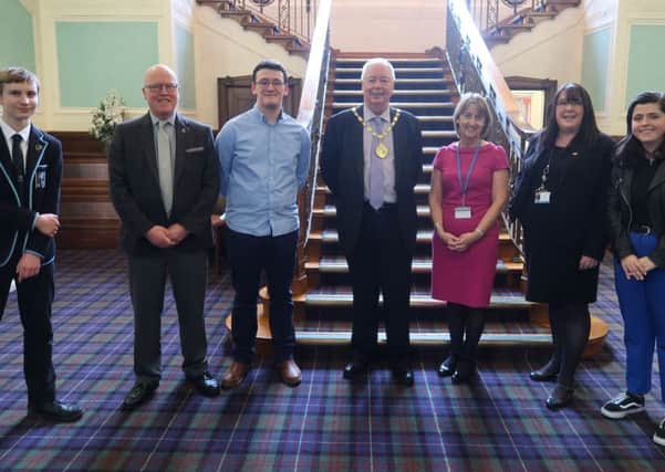 (L-R) Donald Mclean, Cllr. Colm Merrick, Jack Dudgeon, Provost Jim Fletcher, Caroline Innes, Deputy Chief Executive and Returning Officer, Cllr. Annette Ireland and Marissa Roxburgh at the East Renfrewshire Scottish Youth Parliament results event.