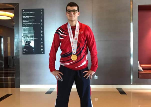 Samuel Scott is pictured with the gold medal he won for skippering GB to success at Special Olympics