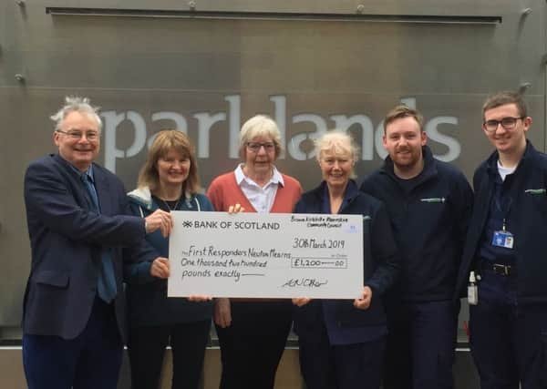 Newton Mearns Community First Responders were presented with a cheque for £1200.