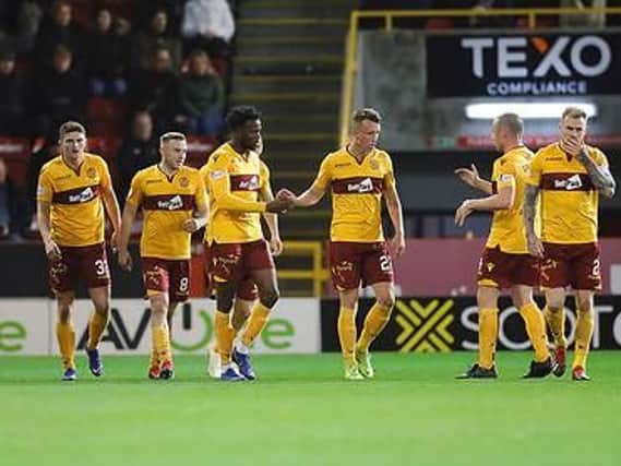 Motherwell players celebrate the equaliser at Pittodrie tonight by Jake Hastie (first left) (Pic by David Cowe)