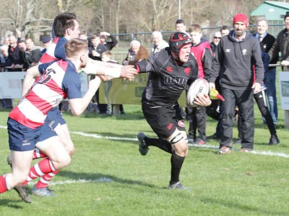 Alan Warnock evades Peebles defence to score Biggars first try in title clinching win at Peebles (Pic by Nigel Pacey)