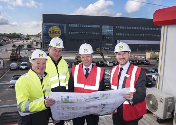 Lidl GBs Gordon Raffertyand Ross Millar welcome Graham Simpson MSP and Neil Gray MP  for a tour of the site of the new warehouse at Eurocentral