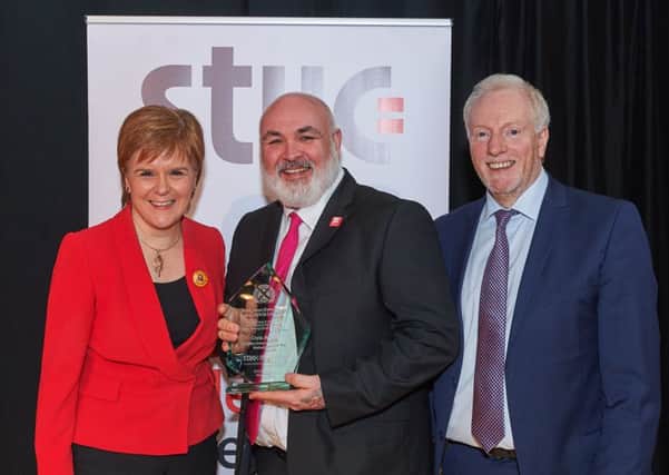 Chris McGill, recipient of the STUC Helen Dowie Award for Lifelong Learning 2019, with First Minister Nicola Sturgeon and Grahame Smith, STUC general secretary