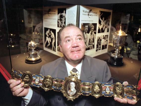Walter McGowan, pictured holding a Lonsdale belt at an exhibition honouring him at Glasgows Kelvingrove art gallery in October 1992, was widely known for his speed around the ring and explosive punching power during a formidable boxing career