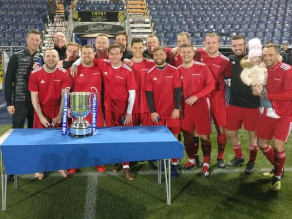 Colville Park AFC players celebrate winning the M and M Trophy (Submitted pic)