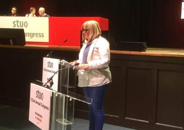 Wilma Wheatley presents the motion about the need to save Cumbernauld tax office to the STUC in Dundee