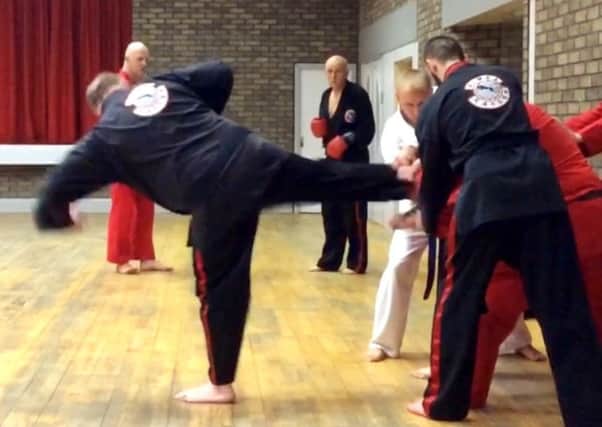 Paul Burns shows off his Taekwondo skills