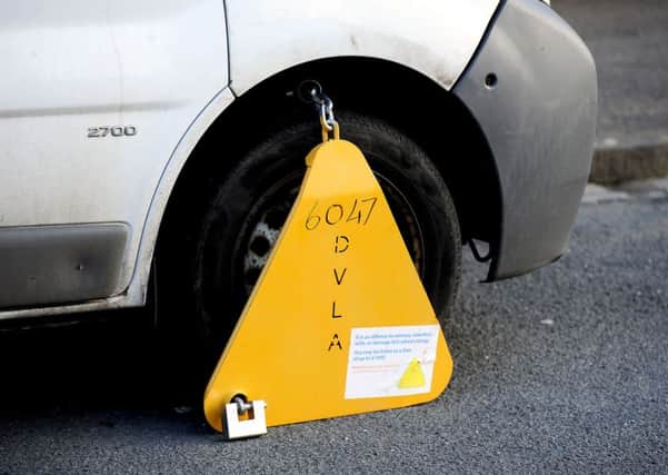 A specialist team will clamp vehicles of owners who will not pay their fine.