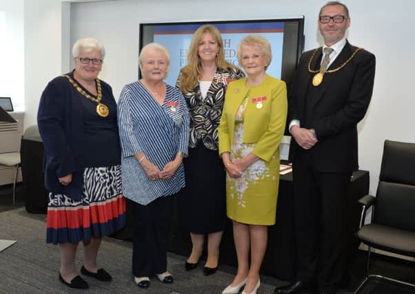 British Empire Medal recipients Elizabeth Rice (in blue) and Elizabeth Wilson (in yellow) at the ceremony with North Lanarkshire provost  Jean Jones, Lord Lieutenant of Lanarkshire, Lady Susan Haughey and South Lanarkshire provost Ian McAllan