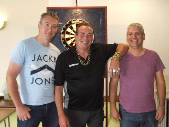 Bobby George (centre) will be entertaining Motherwell punters at darts this Friday night