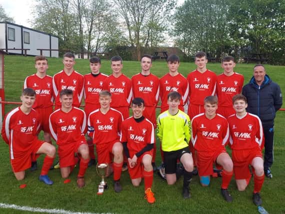 Lanark Grammars Under-18 Lanarkshire Cup winning squad members are pictured with PE teacher and team boss Andy Barr (Submitted pic)
