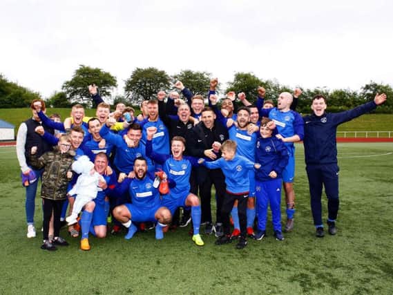 Delighted Carluke Rovers manager Derek Wilson and his players celebrate clinching promotion after Saturdays win (Pic by Billy Quigley)