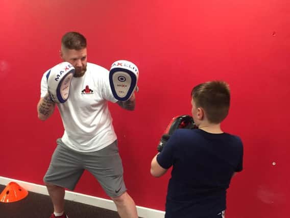 Darren sparring with young fighter