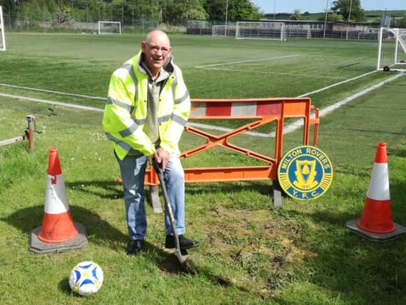 Milton Rovers chairman works on digging foundations for new floodlights (Submitted pic)