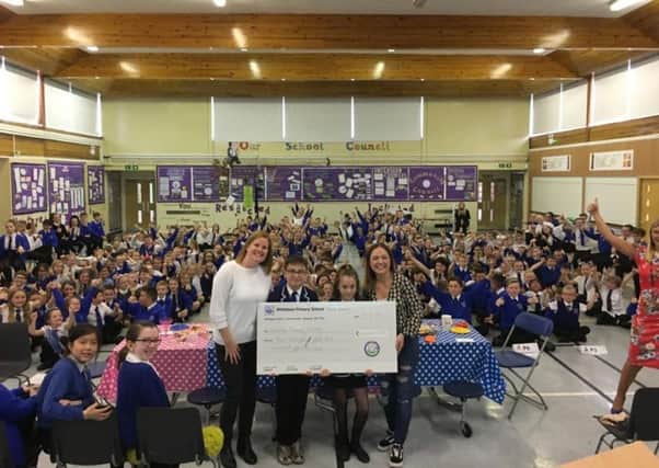 Members of the parent council visited Whiteelees Primary to present the cheque