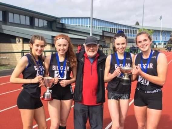 Winning Scottish Schools Relay Championships quartet (from left) Calla Sutherland (age 15) and 16-year-olds Katie Foss, Leah Keisler and Emma Orr, are pictured with their coach Mike Love (Submitted pic)