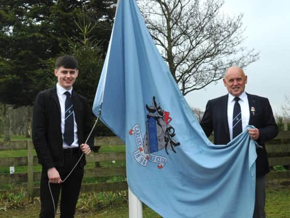 Carluke Golf Club captain John McNeil (right) is pictured with junior captain Callum Wallace at 2019 club opening day this spring