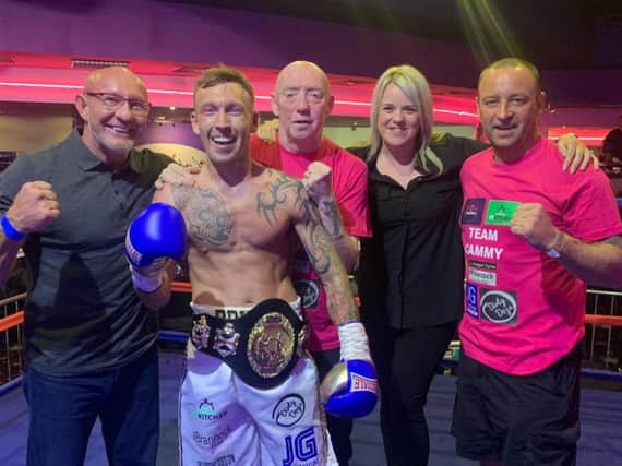 Celtic champ Cameron Kerr is pictured with promoter Frank Gilluley, his wife Kerry and corner men