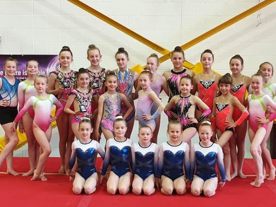 The group of Dynamic Gymnastic Academy girls who excelled at competitions throughout May