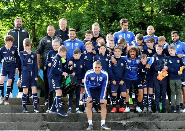 Players from Kilsyth Community FC 2006s with Cyprus players during their training session at Duncansfield (pic courtesy of Cyprus FA)