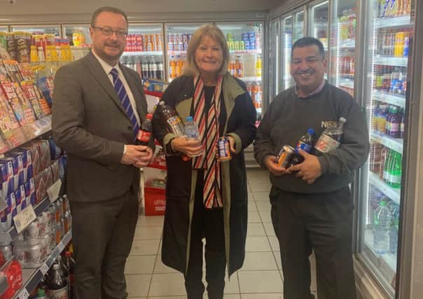 Margaret Mitchell MSP with the Scottish Grocers Federations John Lee and Nisa Local Store owner Abdul Majid