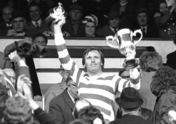 Celtic captain Billy McNeill lifts the Scottish Cup in 1974