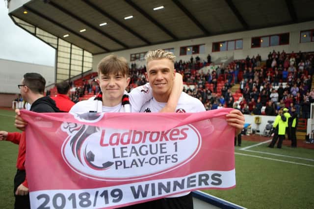 Scott Banks celebrates Clyde's promotion with Tom Lang (Pic by Craig Black Photography)
