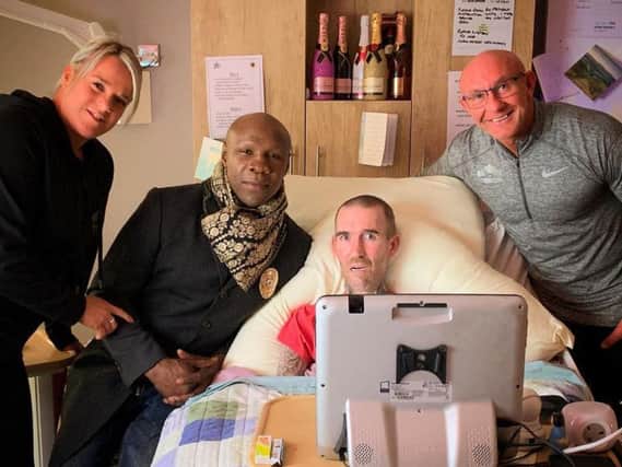 Chris Eubank is pictured with Frank Gilluley and his wife Kerry during a recent visit to see ex-Rangers star Fernando Ricksen at St Andrews Hospice in Airdrie