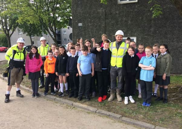 Abronhill Primary pupils with Lovell construction site manager Kevin Kelly as they visited the Cedar Road development