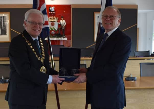 Willie Taylor from Milngavie is honoured for his 20 years of service to the Children's Panel by East Dunbartonshire depute provost Gary Pews