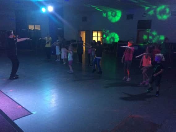 Cumbernauld FM DJ Steven Murray ensures children and families were kept entertained at the Schools Out Disco in Cornerstone House Centre
