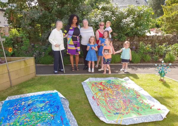 Milngavie Manor residents Eleanor Cheyne and Eileen Brooks with artist Josephine MacLeod (artist), parent Carly Inskip  and youngsters Lucy Eynon, Maisie Eynon, Finlay Eynon, Remi Sharp and Callum Gow