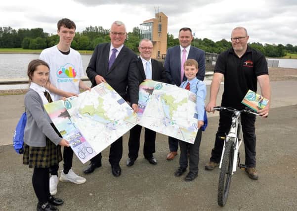 North Lanarkshire Council leader Jim Logue and Councillor Michael McPake help launch the new map and app at Strathclyde Park with pupils from Bellshill Academy, St Bernadettes and Ladywell Primaries, and representatives from council services.