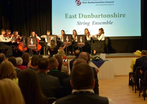 East Dunbartonshire Senior String Orchestra perform for the Queen during her visit to Greenfaulds High in Cumbernauld