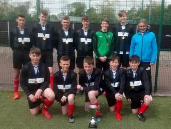 The victorious Lanark Grammar squad are pictured with team manager Johnny Gardiner (Submitted pic)