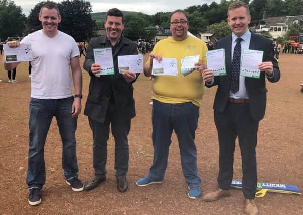 Rennie Road Community Alliance founder Kevin Kane (left) with (l-r) Jamie Hepburn MSP, Councillor Mark Kerr and Stuart McDonald MP on the ash pitch