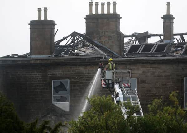 Fighter-fighters attend a major fire at Glasgow Golf Club, one of the oldest and most prestigious in the world, which has gutted most of the building. September 21, 2018.