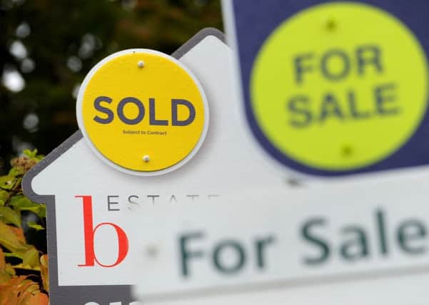 File photo dated 14/10/14 of Sold and For Sale signs. House prices in Britain have increased by ??11 per day on average since the start of the year, analysis has found.