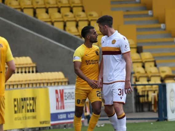 Motherwell defender Declan Gallagher squares up to Livingston's Aymen Souda on Saturday (Pic by Ian McFadyen)