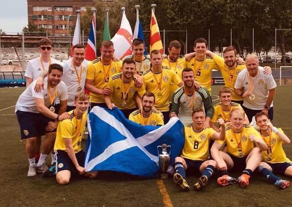 Former Bishopbriggs Academy pupil Ross Russell (centre row, right) celebrates with his Scotland team-mates