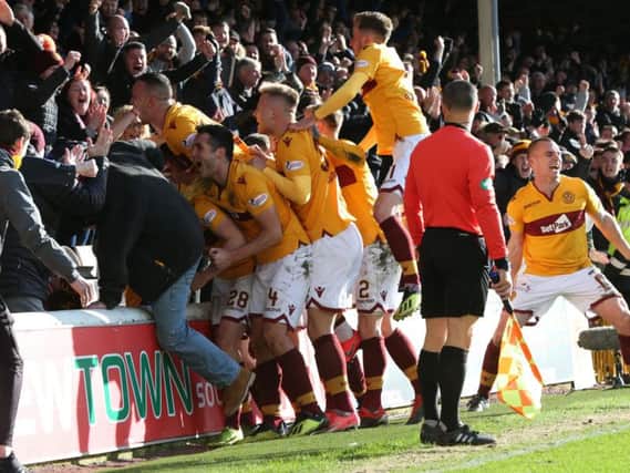 Motherwell players celebrate a 2-1 home league win over Hearts in February (Pic by Ian McFadyen)