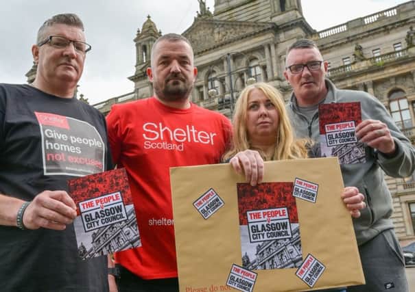 A delegation of previously homeless people deliver a copy of a lawyer's letter to Glasgow City Council.