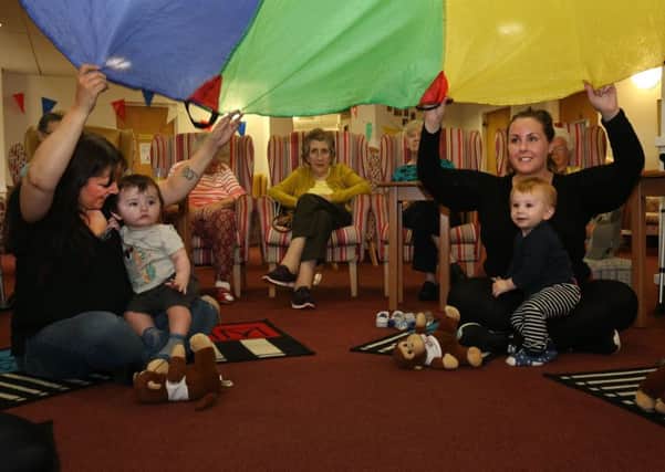 Music Makers & Shakers at Eastwood Court: Cara Anderson with her grandson & Catherine Lowe with her son and residents (Photo: Alister Firth)