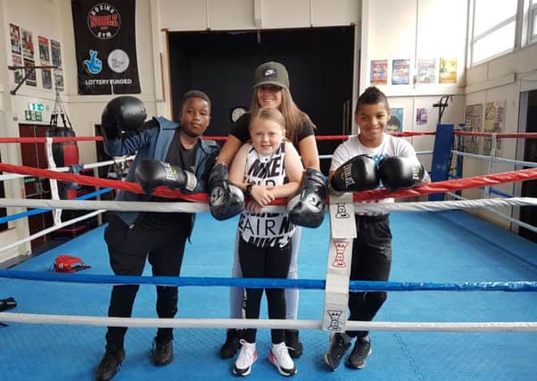 Youngsters Tapi Emmanuel, Hannah Maguire and Kamil Gomo with Kat Paton.