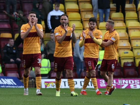 Gallagher (1st left) applauds fans after Hibs win with mates Hartley, Donnelly and Campbell (Pic by Ian McFadyen)