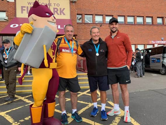 Motherwell captain Peter Hartley (1st right) was among those to greet charity walker Jeff Stelling when he arrived at Fir Park